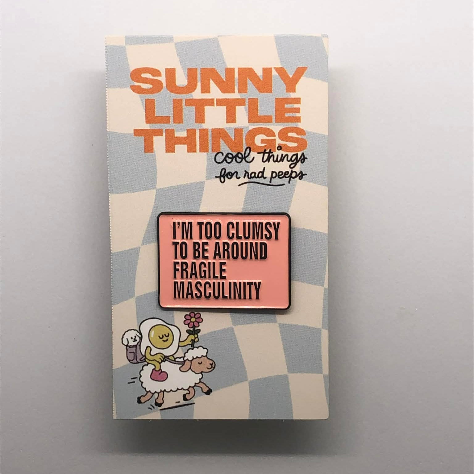 Packaged product with 'Sunny Little Things' branding on a gray background